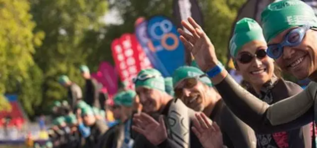 Swimmers waving during Swim Serpentine 2023