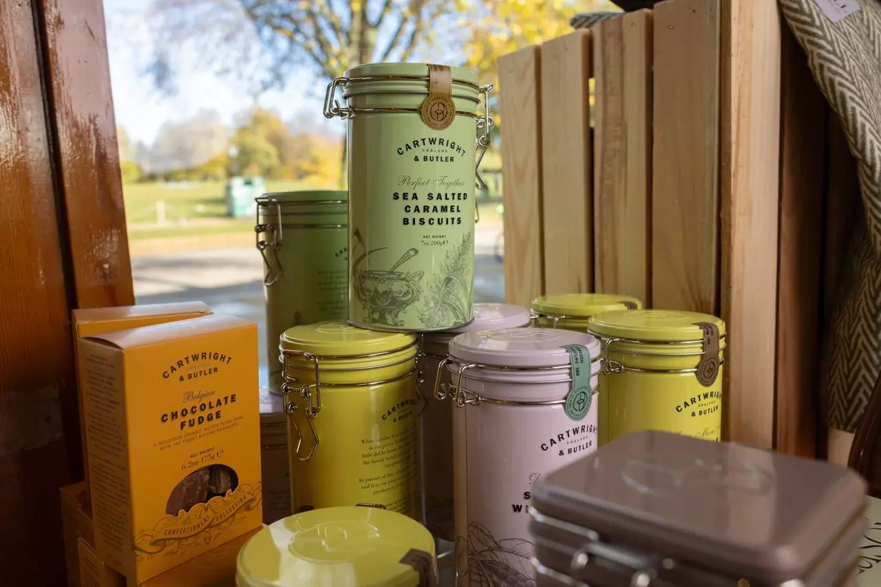 Selection of coloured tins of Cartwright and Butler sweet treats 